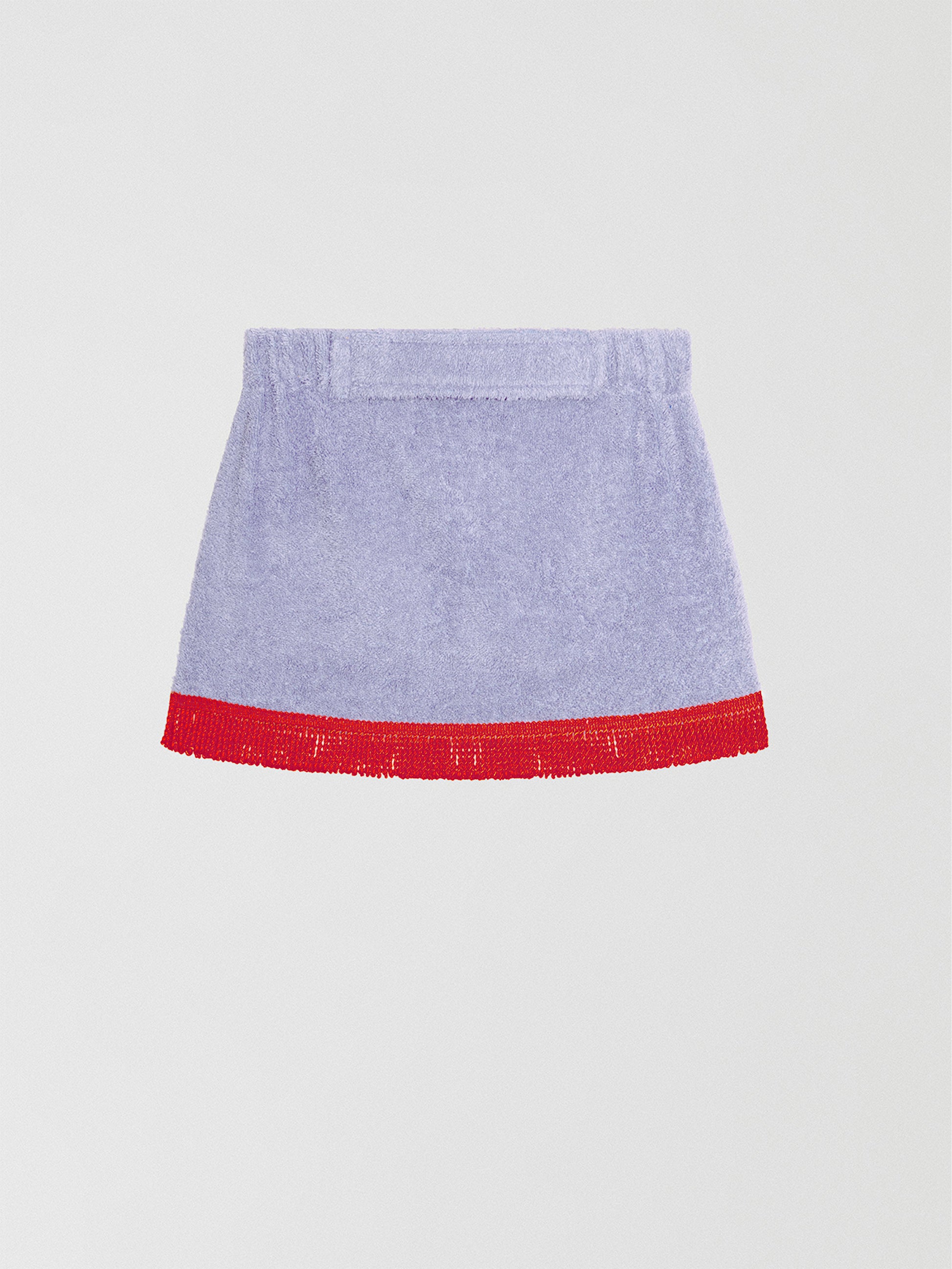 Towel mini skirt made in purple cotton with red fringes. 