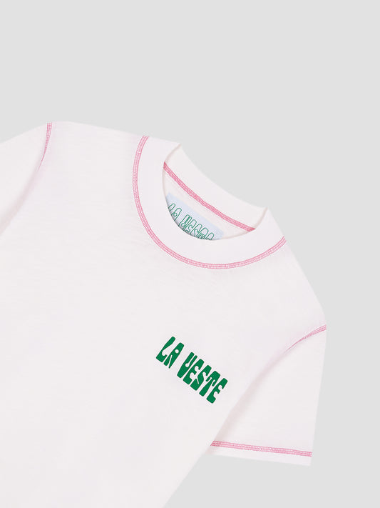 Color: White/Pink.  White cotton T-shirt with LA VESTE logo in green.  Regular fit. Normal length. Round neck. Short sleeves. Collar and sleeve cuffs in pink contrast. Anagram on the chest in green.